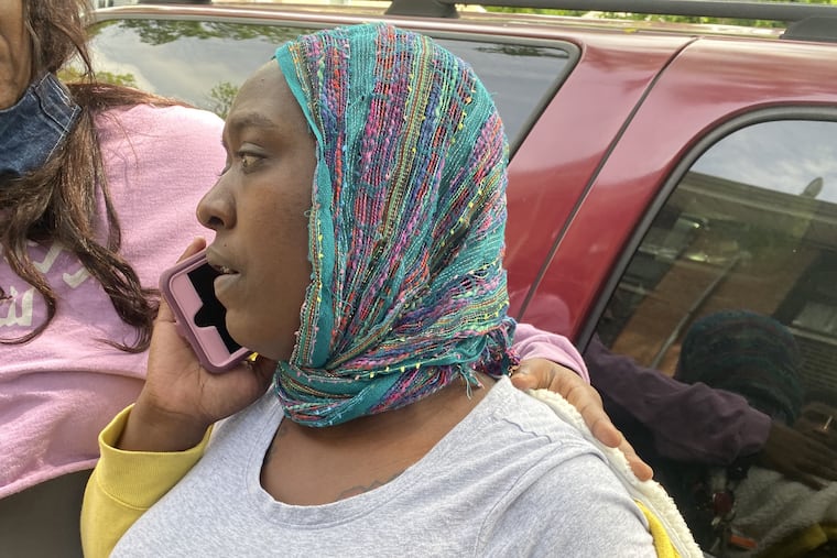 Ashley Hicks, the mother of Rasib Ingram, 9, who accidentally shot himself to death on Tuesday, speaks on the phone in front of her East Germantown home Wednesday, May 27, 2020.