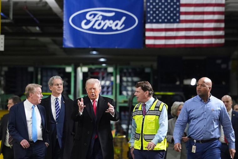 President Donald Trump is joined by company officials during a tour of the Ford River Rogue complex in Dearborn, Mich.
