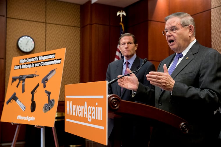 Sen. Bob Menendez (D., N.J.), at right, accompanied by Sen. Richard Blumenthal (D., Conn.), speaks at a news conference on an proposed amendment to ban high capacity magazines in guns, on Capitol Hill, Tuesday, Feb. 12, 2019, in Washington.