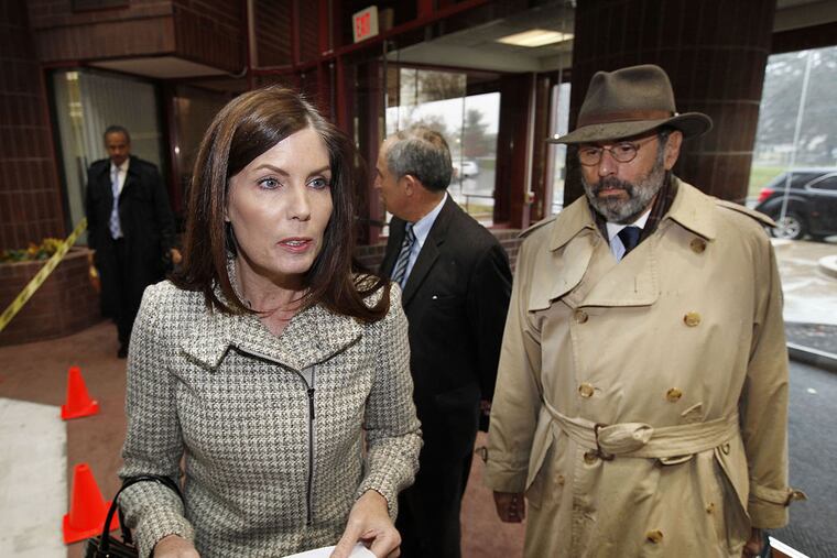 Pennsylvania Attorney General Kathleen Kane a reads a statement to reporters Monday, Nov. 17, 2014 upon her arrival in Norristown, Pa., to testify before a grand jury. Attorney Gerald Shargel is at right. (Michael Wirtz/Staff photographer)