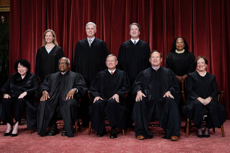 Justices sit for a group portrait at the U.S. Supreme Court Building in Washington in 2022. The court's new term began on Monday.