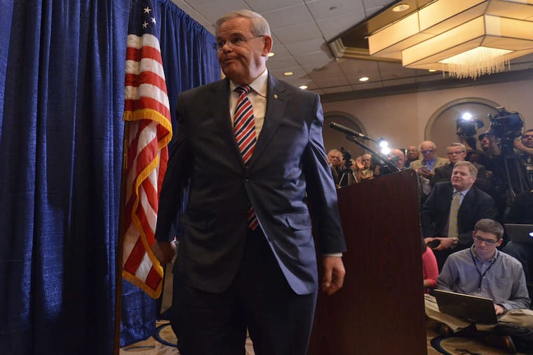 U.S. Sen. Robert Menendez leaves a news conference Wednesday after giving a statement following his indictment. He says he followed the law.