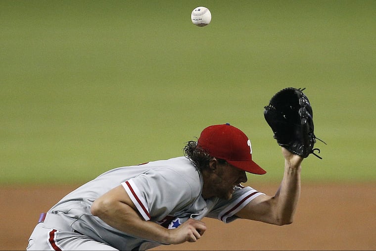 Phillies starting pitcher Aaron Nola ducks under a line drive by Miami infielder Derek Dietrich during the first inning of the Phillies' 2-0 loss.