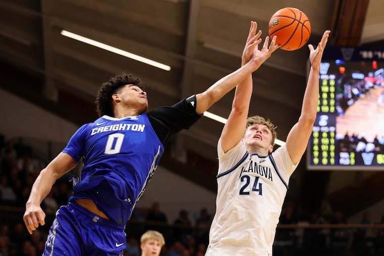 Villanova forward Duke Brennan (24) fights for a rebound against Creighton forward Jasen Green on Wednesday.