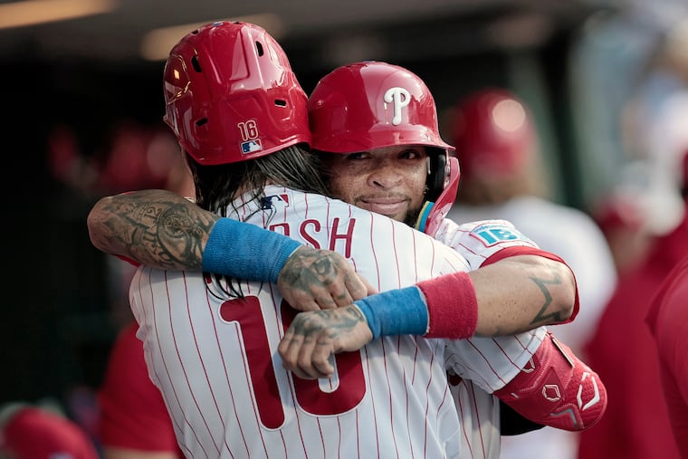 Phillies Edmundo Sosa hugs Brandon Marsh after Marsh's two-run homer in the second inning.