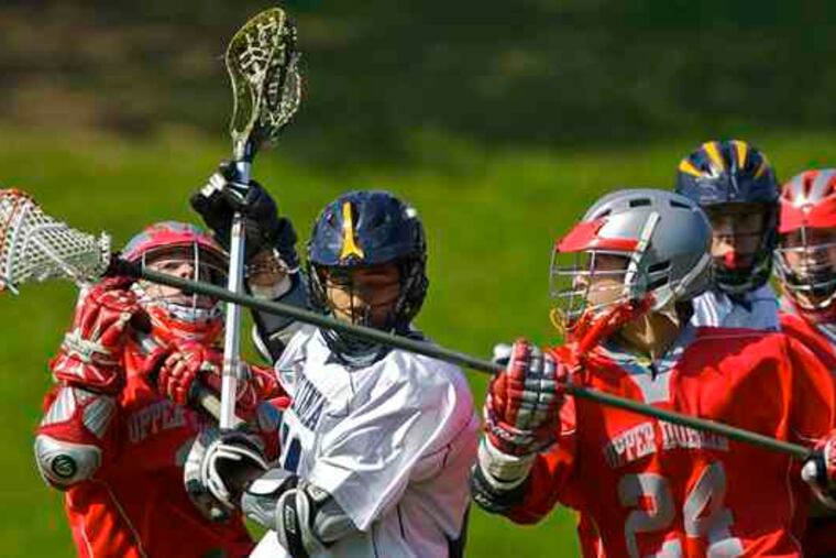 Upper Dublin's Matt Graham (right) steals the ball from Cheltenham's Ben Johnson with help from Kyle Giordano in a blowout.