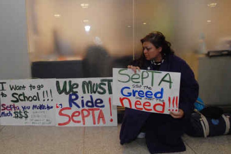 At Suburban Station yesterday, Tila Ayala protests the strike.