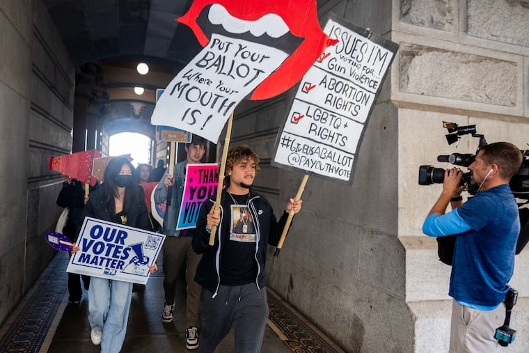 Hundreds of students from 17 Philadelphia high schools marched around City Hall during a youth get-out-the-vote event on Tuesday.