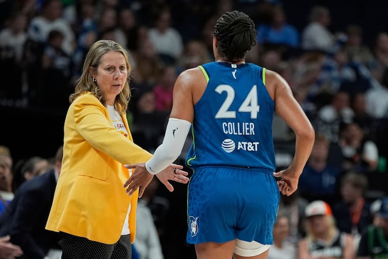 Minnesota Lynx head coach Cheryl Reeve high-fives forward Napheesa Collier (24) during the second half of a WNBA basketball game against the Washington Mystics, Thursday, July 3, 2025, in Minneapolis. (AP Photo/Abbie Parr)