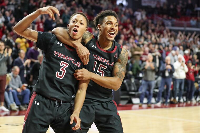 Temple players Josh Pierre-Louis (3) and Nate Pierre-Louis celebrate at the buzzer after an overtime win against SMU at the Liacouras Center in Philadelphia on Saturday, Feb. 08, 2020. Temple won, 97-90, despite trailing by double-digits in the first half of the game.