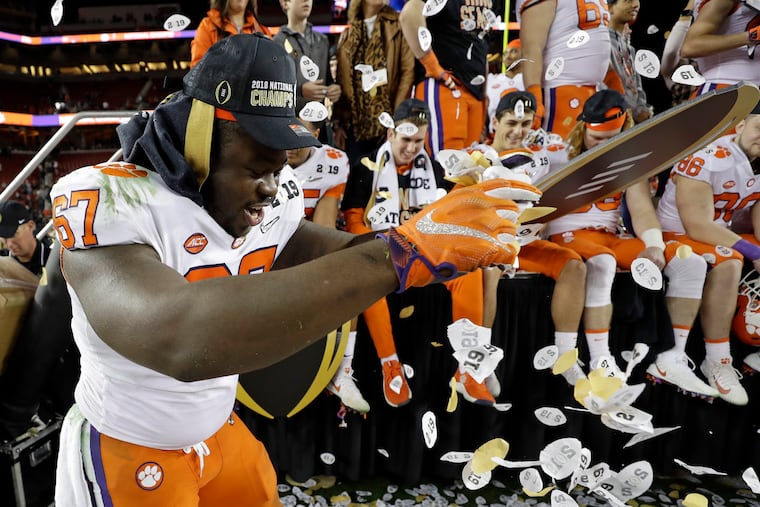 Albert Huggins, then with Clemson, celebrates after the team's college football championship victory over Alabama in January.