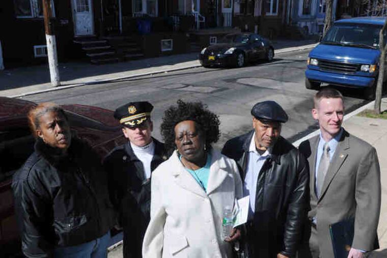Working together in Hartranft as part of PhillyRising are (from left) Arnetta Curry, 26th District Capt. Mike Cram, Diane Bridges, Jesse Crosby and City Deputy Managing Director John Farrell. SARAH J. GLOVER / Staff photographer