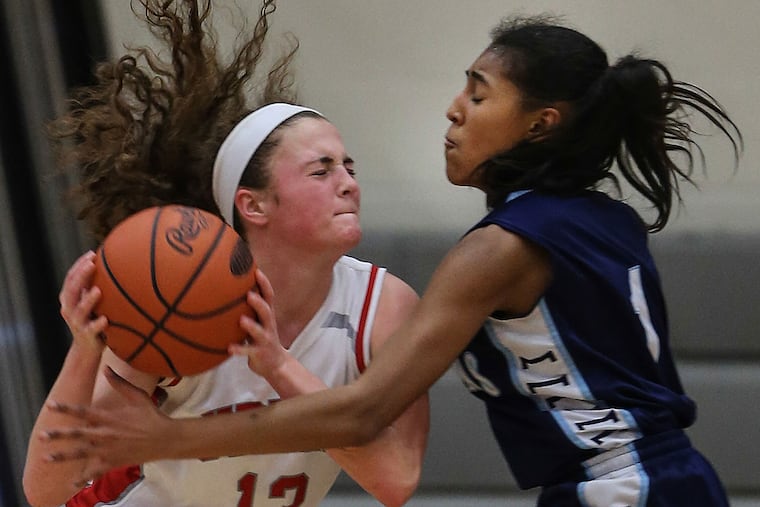 Upper Dublin's Rebecca Watson tries to get by Springfield's Siana
Wynn.