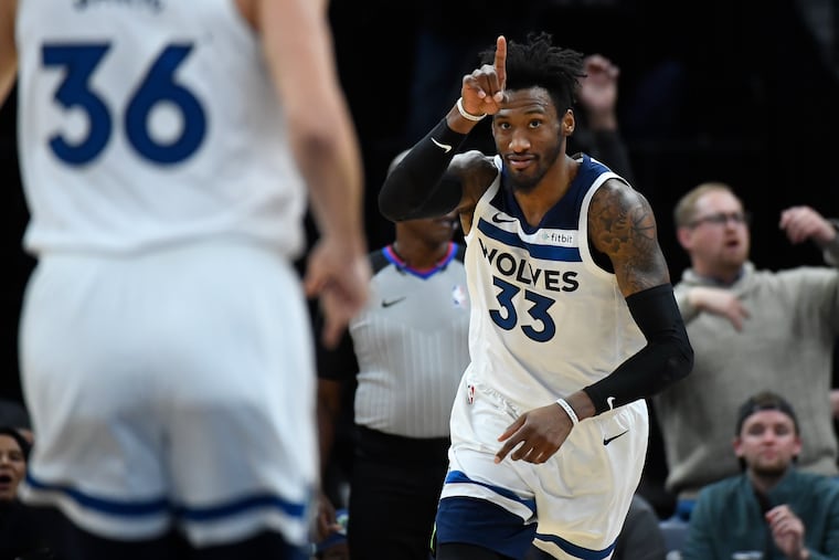Robert Covington celebrates after scoring for the Timberwolves last month.