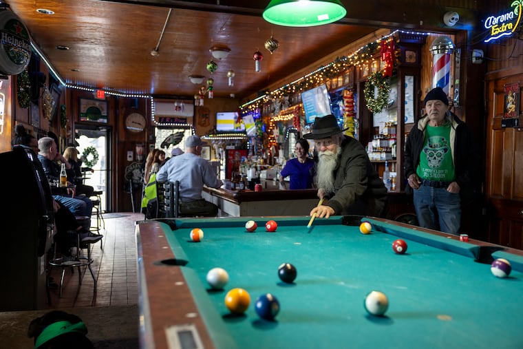 Al Luecke, 77, of Fishtown, a regular at J.R’s Saloon for 25 years, playing pool on Thursday, Dec. 18, 2025.
