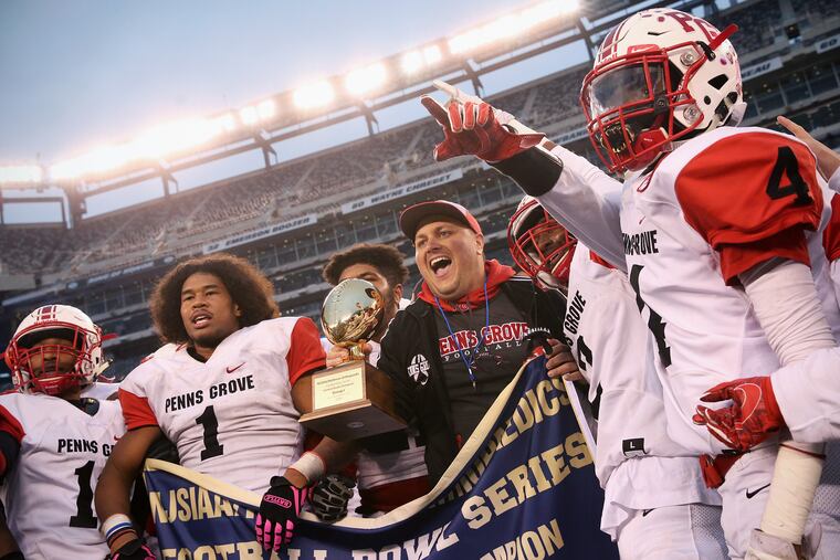 Penns Grove coach John Emel and his players celebrate 35-26 win over Willingboro in Group 1 South/Central Bowl Game.