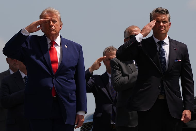 President Donald Trump and Defense Secretary Pete Hegseth salute as a U.S. Army carry team moves a transfer case containing the remains of Pvt. Isabella Gonzales of Carrollton, Texas at Dover Air Force Base, Del. on July 22.