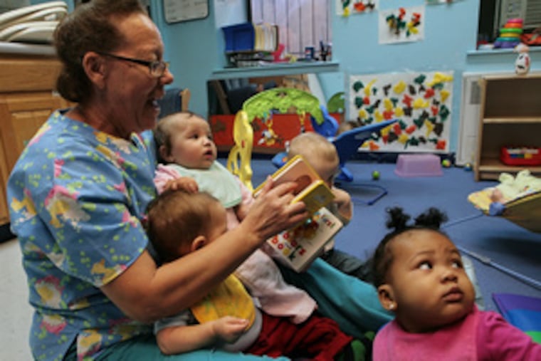 Maggie Jenkins prepares story-time reading for infants at the Hale House learning center.