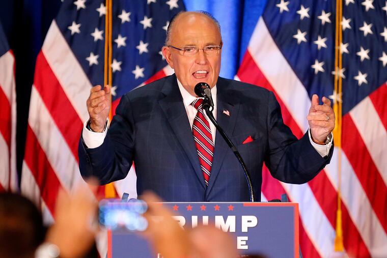 Inquirer Editorial: Former New York Mayor Rudy Giuliani, seen here at a Donald Trump rally in Ohio in August 2016, should not be Trump's cyber security advisor.