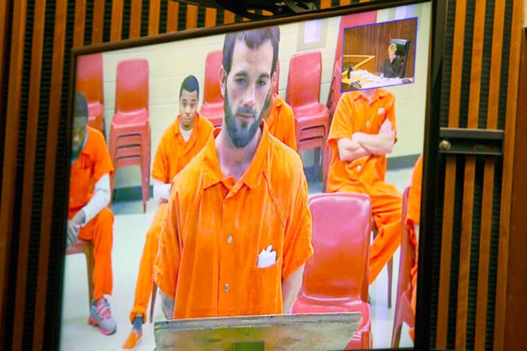 Kyle Crosby, 28, was charged Tuesday, Jan. 13, 2015, with murder in the death of his wife, Erica Crosby, 26. He appeared by video for an arraignment in Burlington County Superior Court in Mount Holly. ( CHARLES FOX / Staff Photographer )