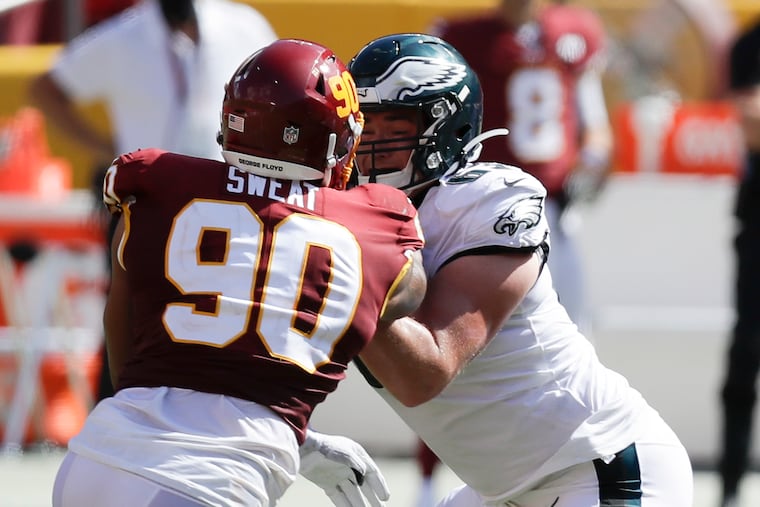 Eagles offensive tackle Jack Driscoll blocks Washington Football Team defensive end Montez Sweat.