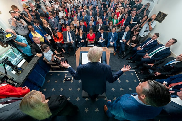 President Donald Trump speaks with reporters in the James Brady Press Briefing Room at the White House in August.