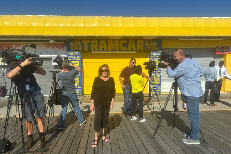 Floss Stingel, who recorded "Watch the Tram Car Please," message more than 50 years ago, on the North Wildwood Boardwalk after announcing that she is suing Wildwood, Morey's Piers and others for compensation. She says she's never received any money despite her voice being used for commercial and tourism purposes.