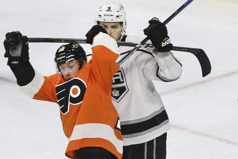The Flyers’ Michael Raffl tangles with the Kings’ Adrian Kempe during the second period at the Wells Fargo Center.