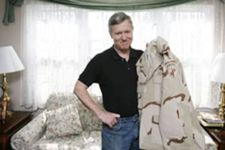 Retired Army Col. Tom Collins of East Norriton, with his uniform from his service in Iraq in 2003. He remembers preparing for chemical and biological attacks that never came and watching "young Marines, fresh from training," getting set to enter Iraq.