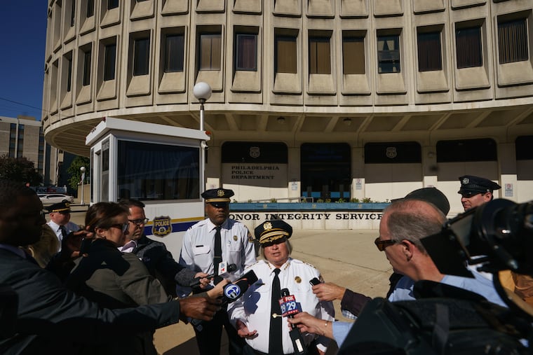Acting Philadelphia Police Commissioner Christine M. Coulter (center).