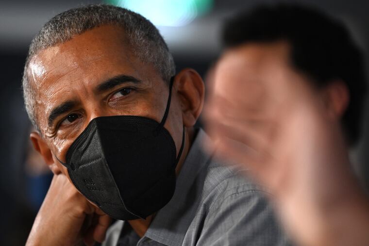 In this photo from November 8, 2021, former US President Barack Obama attends a round table meeting at the University of Strathclyde in Glasgow, Scotland.