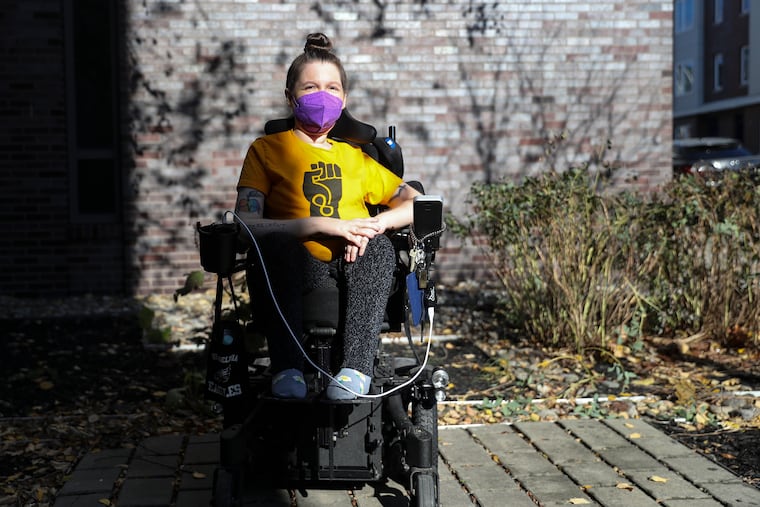 Heather Kerstetter poses for a portrait outside of her building in North Philadelphia.