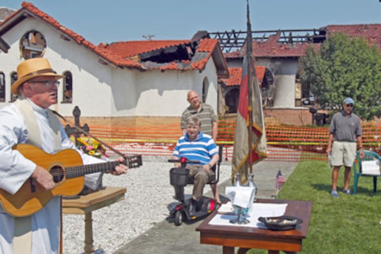 Summary: Church of the Redeemer in Longport, NJ destroyed in Friday's storm will have a lawnside service when we expect the parishioners will vow to rebuild.
CAPTION -- Church Pastor Rev. John Baker is conducting Sunday services at the lawn next to the burned church.
( AKIRA SUWA / Staff Photographer )