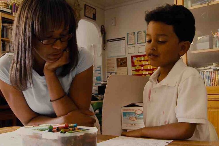 Teacher and a pupil interact in a scene from the documentary "Waiting for Superman," which examines the state of education as seen through the eyes of five families.