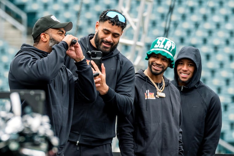 Eagles players (from left) Brandon Graham, Jordan Mailata, Darius Slay Jr., and Saquon Barkley at a send-off party on Lincoln Financial Field as fans celebrated the team heading to the Super Bowl on Sunday. Eagles cheerleaders, a drum line, mascot Swoop, musician Vanya Sax, and DJ Diamond Kuts also appeared at the send-off. Ticket proceeds benefited the Eagles Autism Foundation.