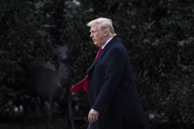 President Donald Trump crosses the White House's South Lawn on Friday to leave for the holidays.