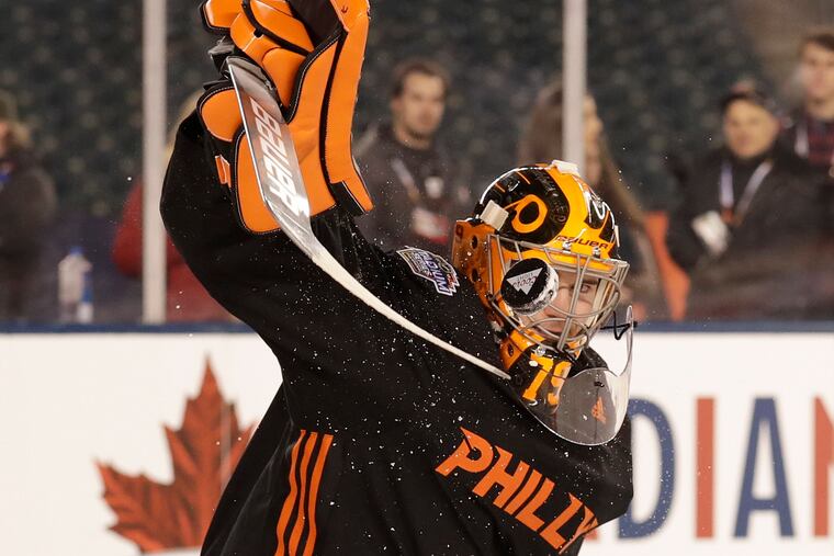 Flyers goaltender Carter Hart stops the puck during practice at Lincoln Financial Field on Friday, February 22, 2019. The Flyers take on the Pittsburgh Penguins in a Stadium Series game tomorrow evening.