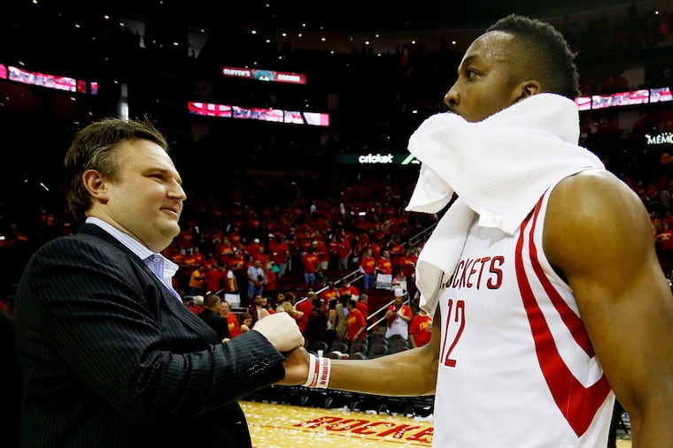 Dwight Howard (right), then with the Houston Rockets, celebrates with then-general manager Daryl Morey, now with the Sixers, in 2015. They are back together.