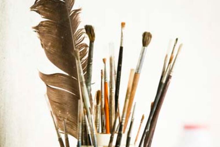 Ed Sozanski writes about Andrew Wyeth's Chadds Ford studio, which will be open to the public beginning July 3, 2012. Here, some of Wyeth's brushes and a feather.( ED HILLE / Staff Photographer )