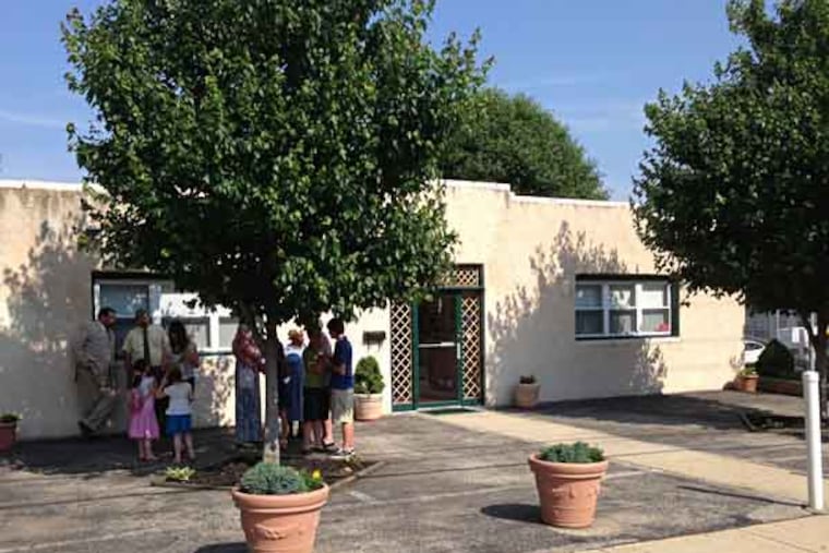 Members gather outside First Century Gospel Church on Sunday, June 9 / SOLOMON LEAH / DAILY NEWS STAFF