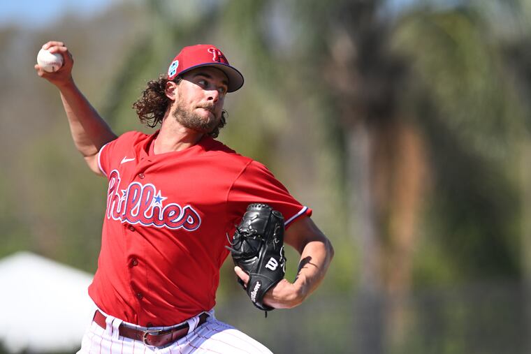 Phillies pitcher Aaron Nola throws during spring training workouts in Clearwater, Fla. The Phillies 2023 spring training schedule gets underway Saturday against the New York Yankees.