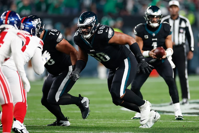 Eagles tackle Jordan Mailata preparing to block after a snap to Jalen Hurts against the Giants on Monday. "They were just loud,” Mailata said of the fans at the Linc. “I was trying to just lock in, not get any more false starts.”