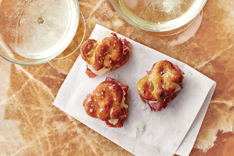 As the Eagles take on the Saints this Sunday, celebrate with delicious Philly-style eats, such as these Mini Reuben Pretzel Sandwiches, along with a dose of New-Orleans-inspired fare.
