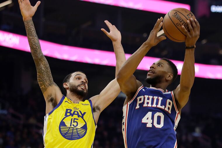 The 76ers' Glenn Robinson III shoots against the Warriors' Michael Mulder during the first half Saturday.