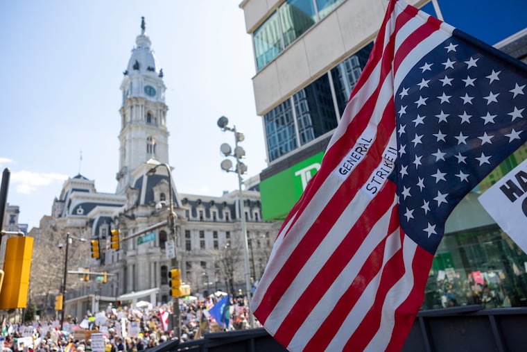 Protesters gather for the third “No Kings” rally at City Hall on Saturday.