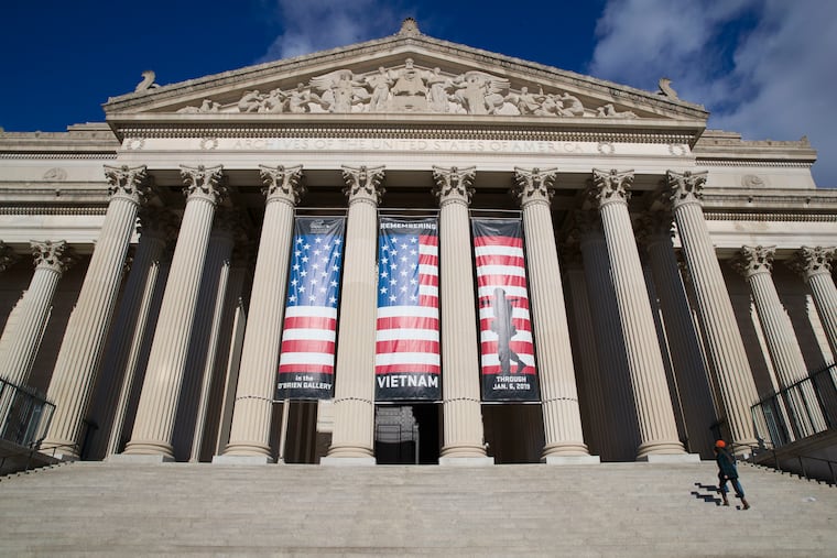 People walk up the steps even though the National Archives is closed with the partial government shutdown, Dec. 22, 2018 in Washington. While the Archives safeguards precious national documents such as the Declaration of Independence, the Constitution and the Bill of Rights, that's only the public face of their sprawling collection, which spans 13 billion pages of text and 10 million maps, charts and drawings, as well as tens of millions of photographs, films and other records.