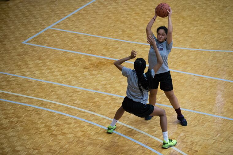 Dajah Horsey, top, a senior point guard for Girard College, says she’s essentially raised herself since around 12.