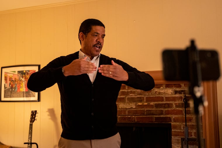 Jay Fluellen, music teacher at Northeast High School, goes through singing warmups with his his choir class from his home in Elkins Park, along with co-teacher Patricia Betcher, using Zoom.
