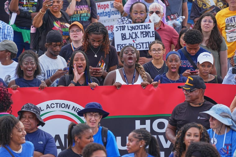 Demonstrators shout to speakers during the March on Washington, near the Lincoln Memorial, Friday, Aug. 28, 2026, in Washington.