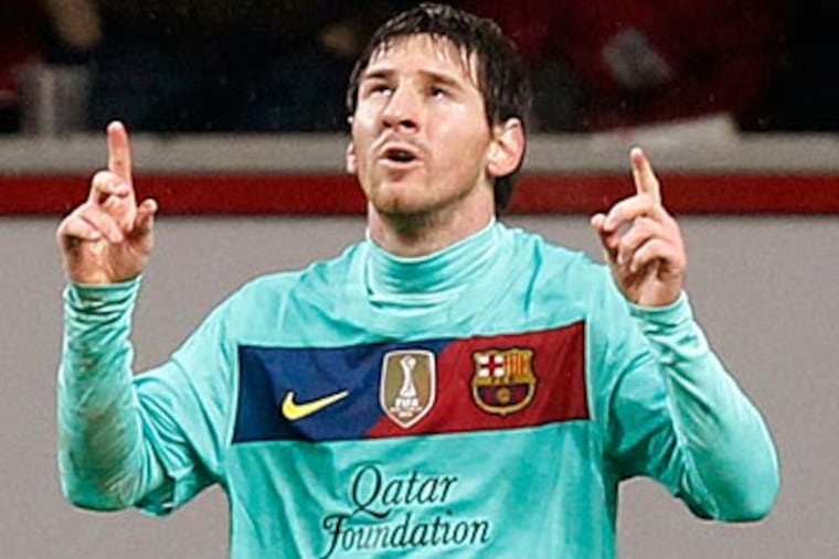 Lionel Messi scored one goal in Barcelona's 3-1 Champions League win at Leverkusen. (Roberto Pfeil/AP)